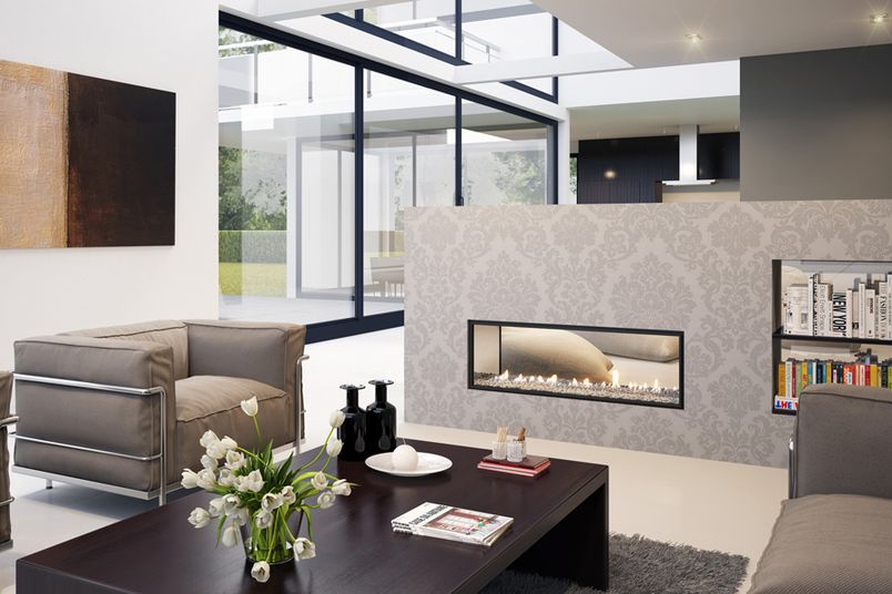An Escea double-sided, frameless transparent crystalight fuel bed DX1000 gas fireplace.