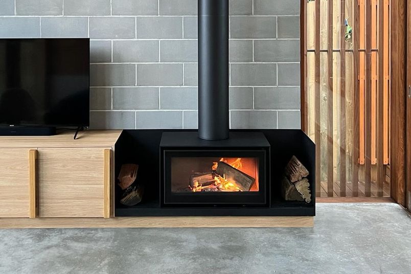 ADF Linea 85 B wood-burning fireplace features a contemporary, bold design.