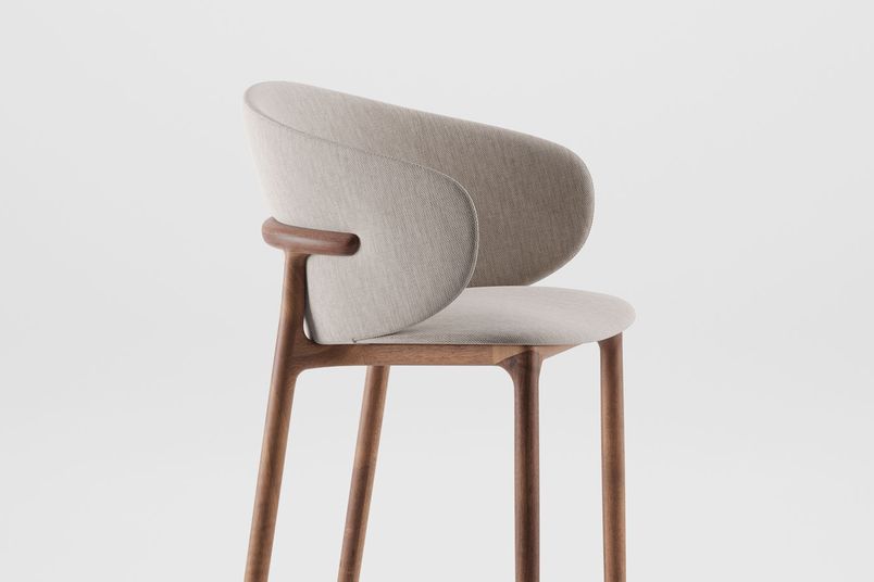 Mela bar chair in European walnut, natural oil and fabric upholstery.