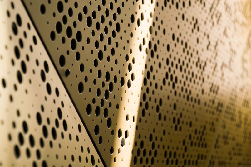 Champagne Gold perforated metal panels by Arrow Metal.